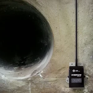 Overflow detector installed with its fixing plate